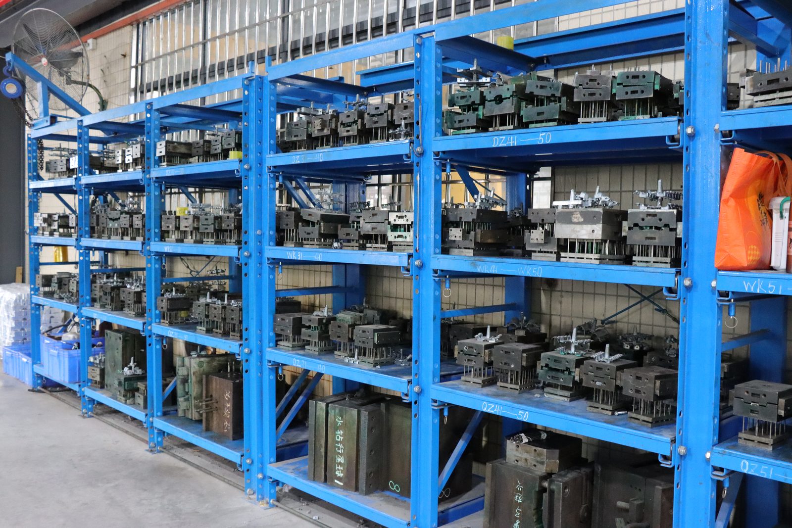 Racks of aluminium extrusion dies stored in the tooling department